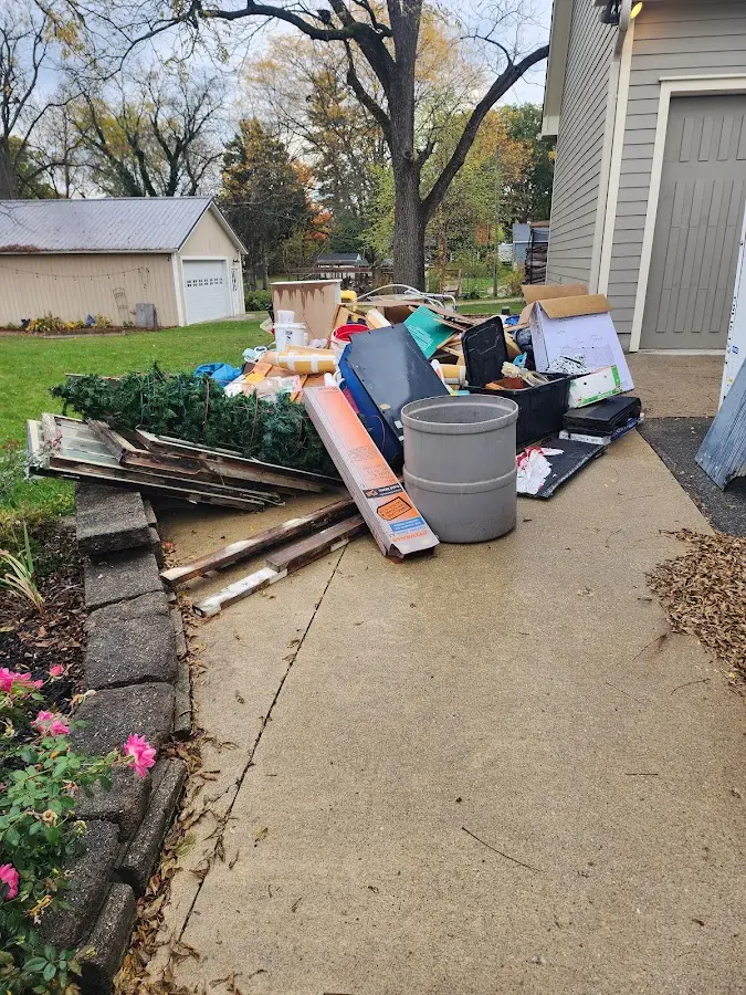 Dumpster being loaded with debris for Roofing Dumpster Rental in Aliquippa